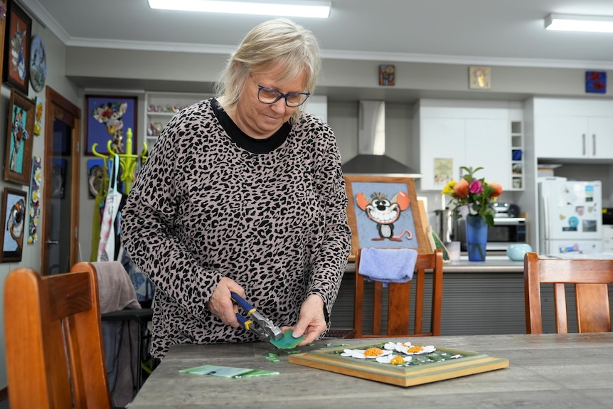 Julie in her studio working on a mosaic.