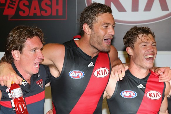 That winning feeling: James Hird in 2015, with Jake Melksham (right) and Tom Bellchambers.