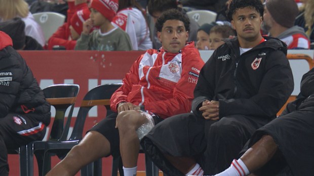 Tyrell Sloan is seen with ice on his hamstring on the sidelines.