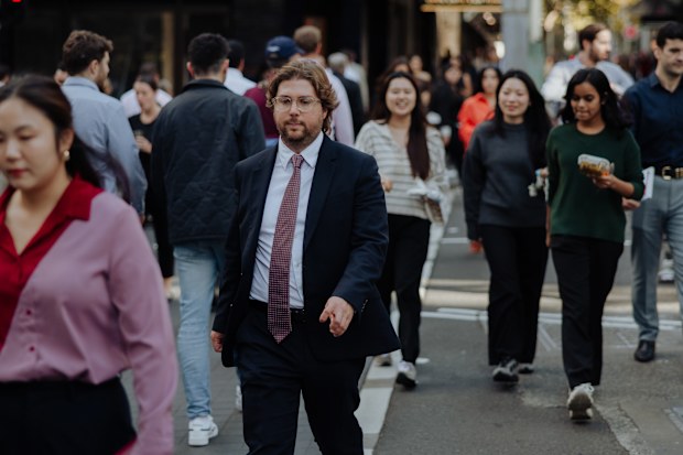 Pedestrians and office workers walk through the Sydney CBD.