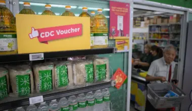 A promotional sign informing customers that CDC vouchers can be used seen outside Prime Supermarket at Jurong West Street 91 on June 11.