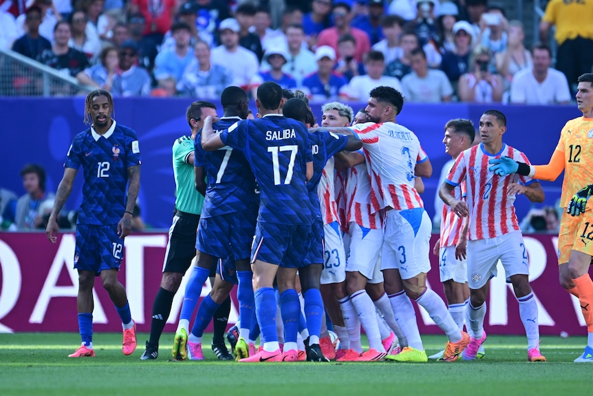 France and Paraguay players scuffle