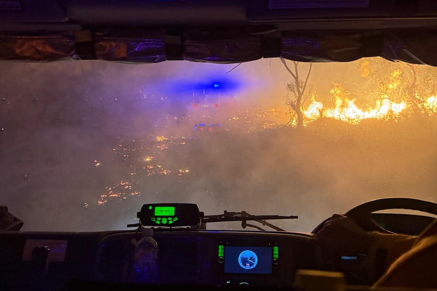 Fire at night seen from a fire truck.