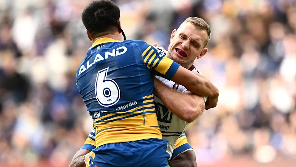 Ronald Volkman (6), seen tackling Tom Trbojevic.
