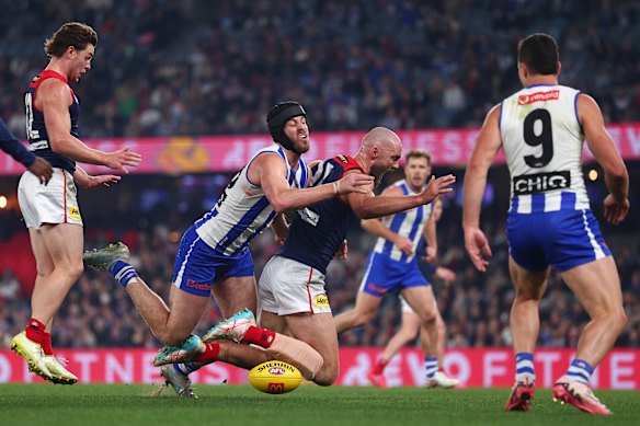 Max Gawn of the Demons and Tristan Xerri of the Kangaroos contest the ruck.