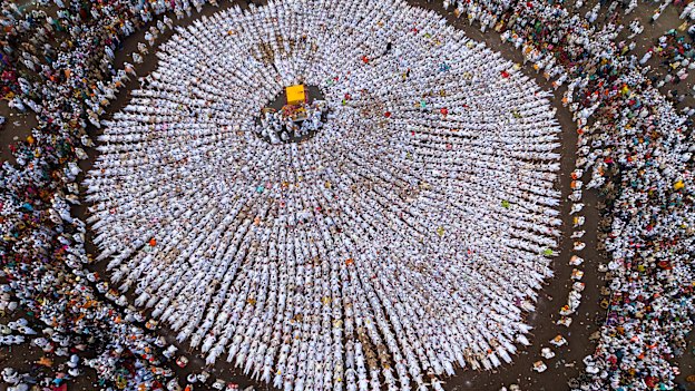 Photograph of the year 2026: Second place: Sanghamitra Sarkar, India. Wari - A gathering of Warkaris during Maharashtra’s Wari pilgrimage forms a circular pattern around the central palkhi.