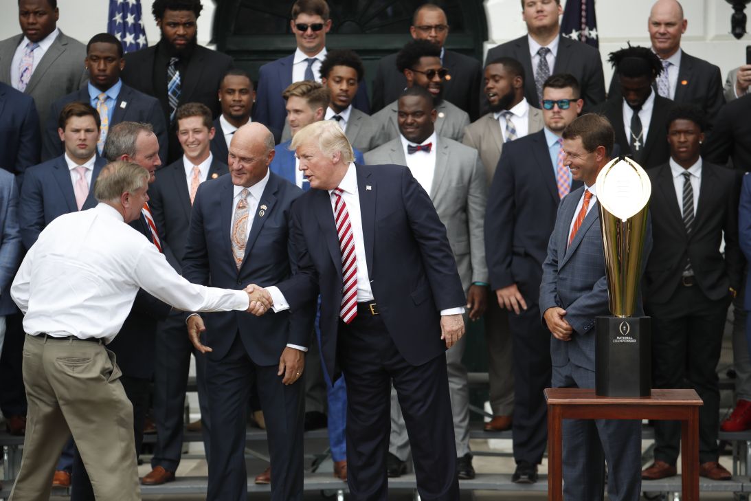 Trump shakes hands with Graham on the South Lawn of the White House on June 12, 2017.