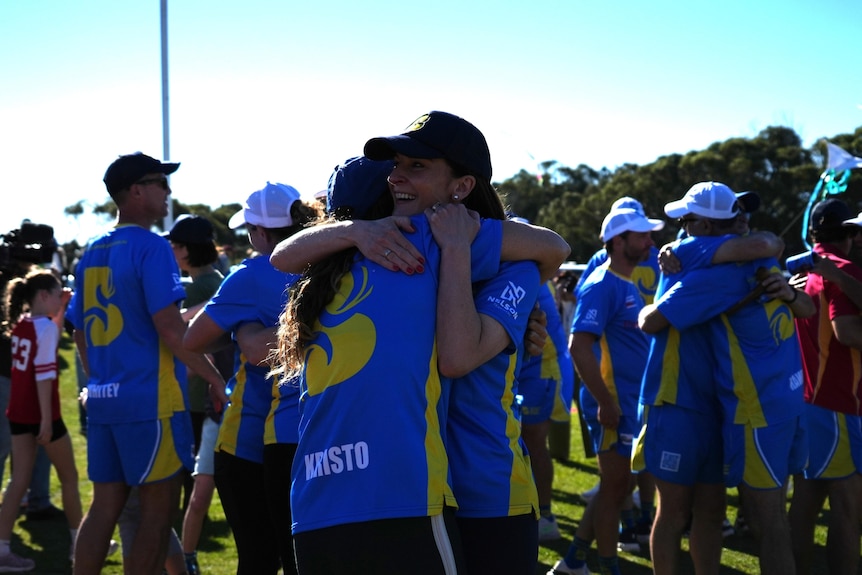 Two girls hug each other