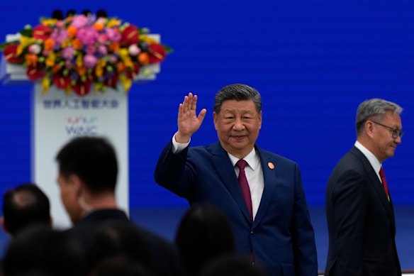 Chinese President Xi Jinping waves as he arrives at the opening ceremony for the World AI Conference.