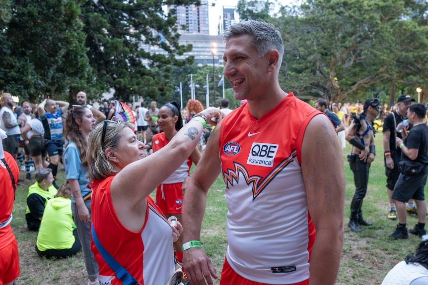 Sydney Swans CEO Matthew Pavlich with Rainbow Swans chair Sarina Jackson.