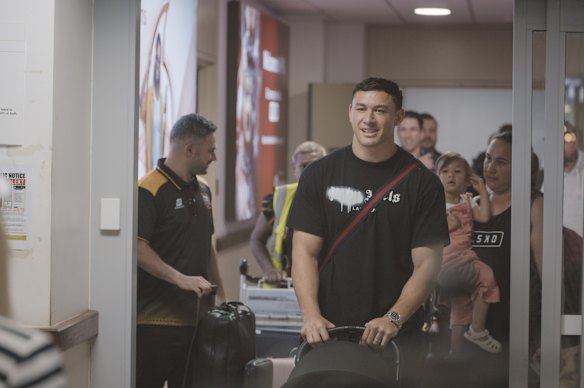 Former Rooster Joey Manu and his family at Port Moresby airport on Monday.