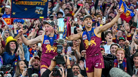 Lion power: Logan Morris and Kai Lohmann enjoy that premiership feeling last year.