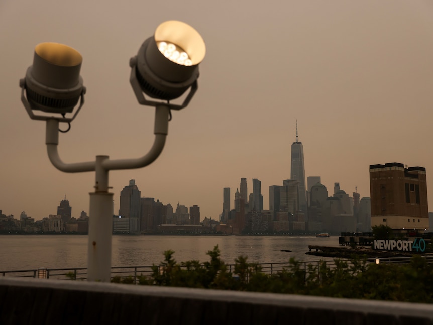 Smoke blankets a city skyline.