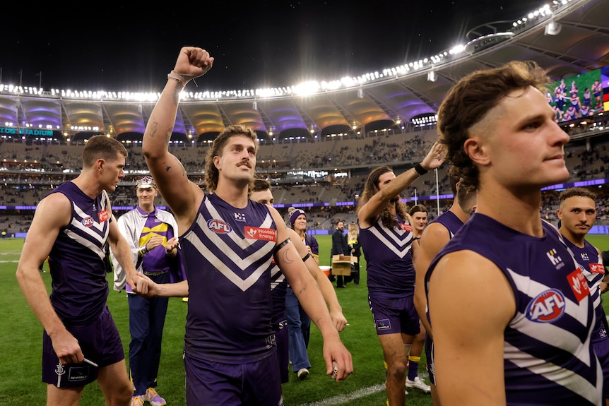 Dockers leave the field after beating Sydney Swans.