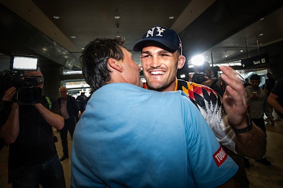 Laurie Daley gives Nathan Cleary one last hug before parting company at Sydney airport.