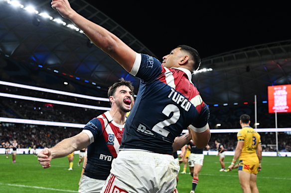 Daniel Tupou celebrates a try against Parramatta.