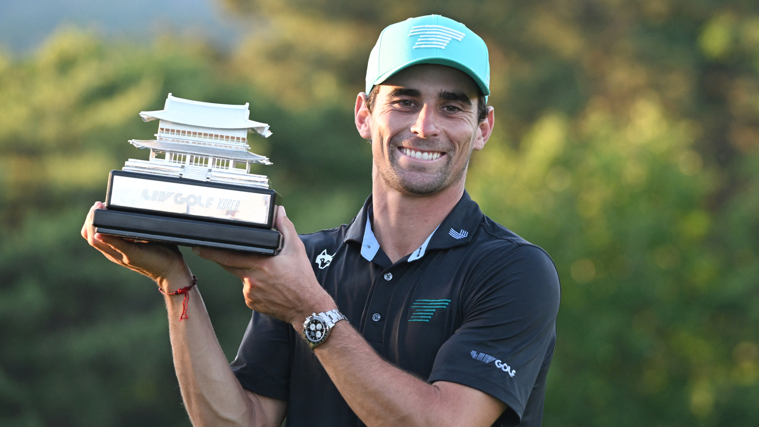 Joaquin Niemann with the LIV Golf Korea trophy