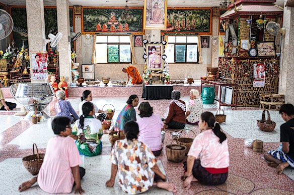 Family of 17-year-old Thanchanok Donhomla attend a ceremony at a Buddhist temple in Kalasin.