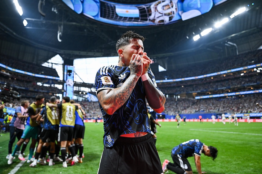 Enzo Fernandez kisses his Argentina jersey in celebration