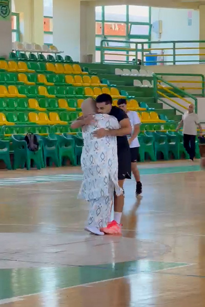 Alie hugging someone to celebrate