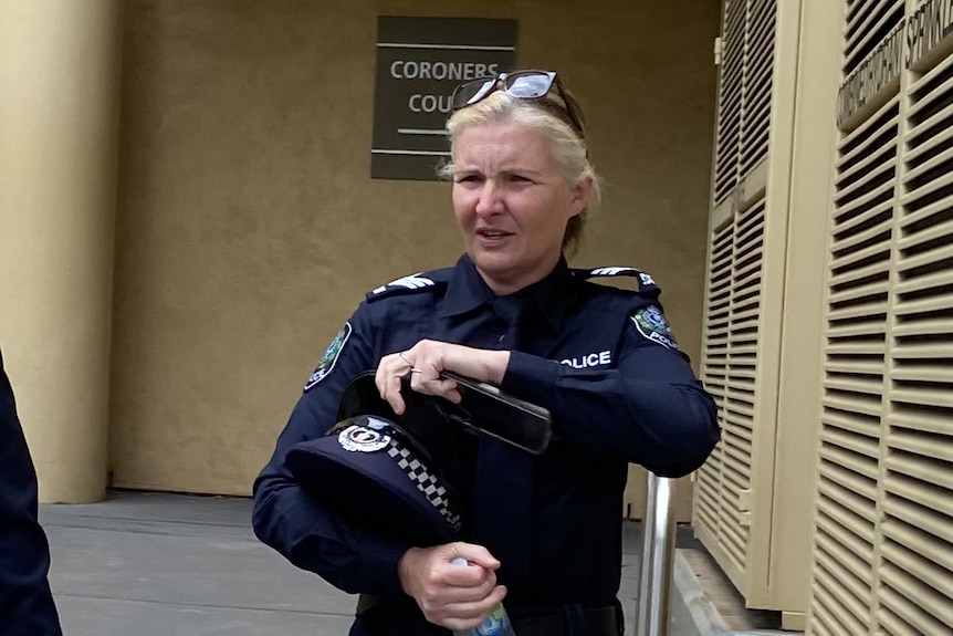 Police officer leaving coroners court