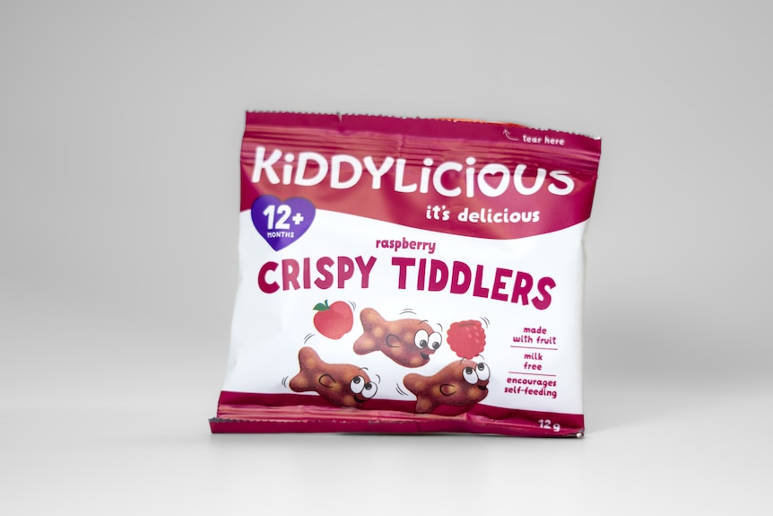 a pink and white packet of raspberry-flavoured rice crisp snacks