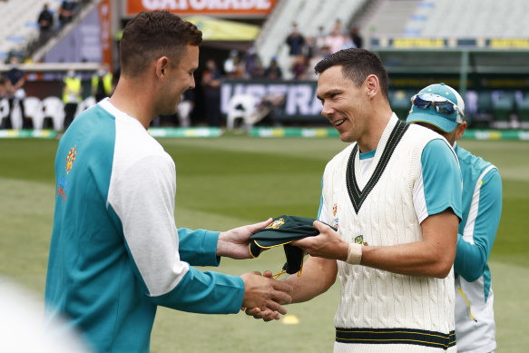 Scott Boland received his baggy green cap from Josh Hazlewood before the third Test against England at the MCG in 2021.