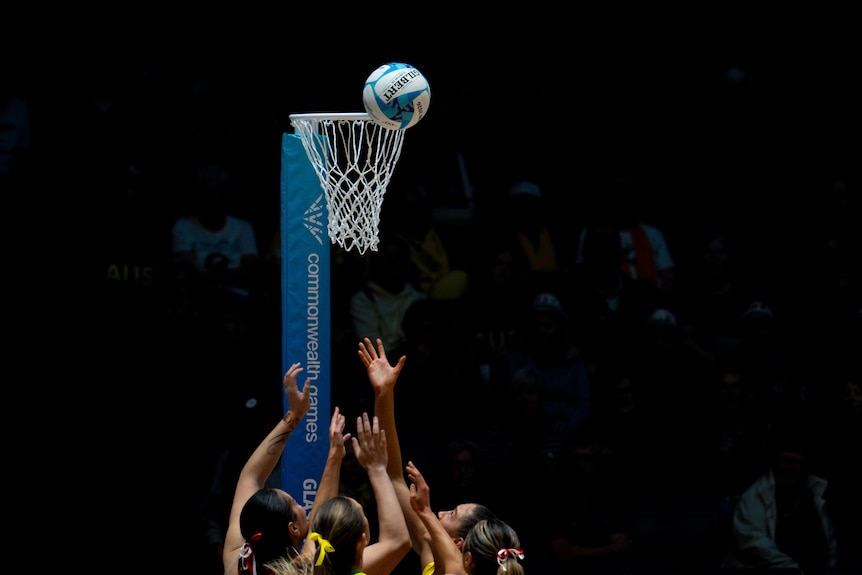 Tonga and Australia players reach for the ball in their netball group game at the 2026 Glasgow Commonwealth Games.