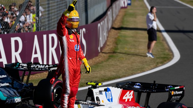 Lewis Hamilton of Britain celebrates after setting a pole position for the sprint race at the British F1 Grand Prix.