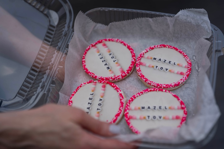 A close up of cookies covered in pink.