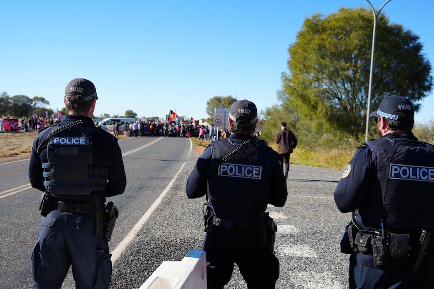 Police officers watching a protest