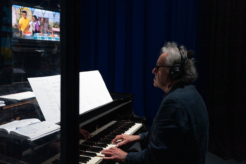 Play School's musical director and pianist, Peter Dasent, at the piano.