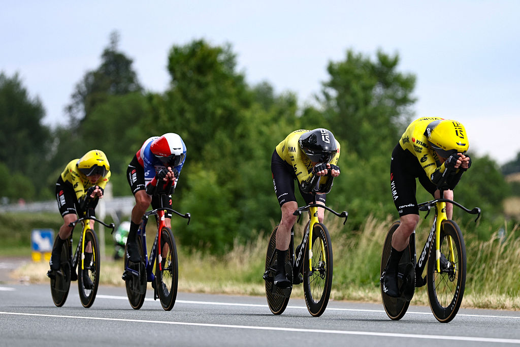 Team Visma | Lease a Bike's team riders cycle during the 3rd stage of the Tour Auvergne-Rhone-Alpes cycling race (formerly known as the Criterium du Dauphine), 28,4km team time trial departing and arriving in Perreux central France, on June 9, 2026. (Photo by Anne-Christine POUJOULAT / AFP)