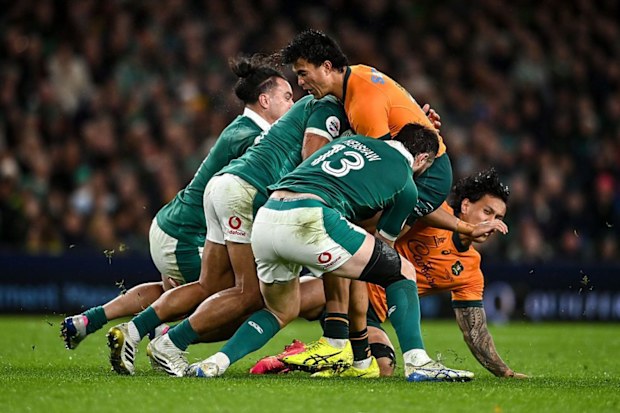 Joseph-Aukuso Suaalii of Australia is tackled by Ireland.