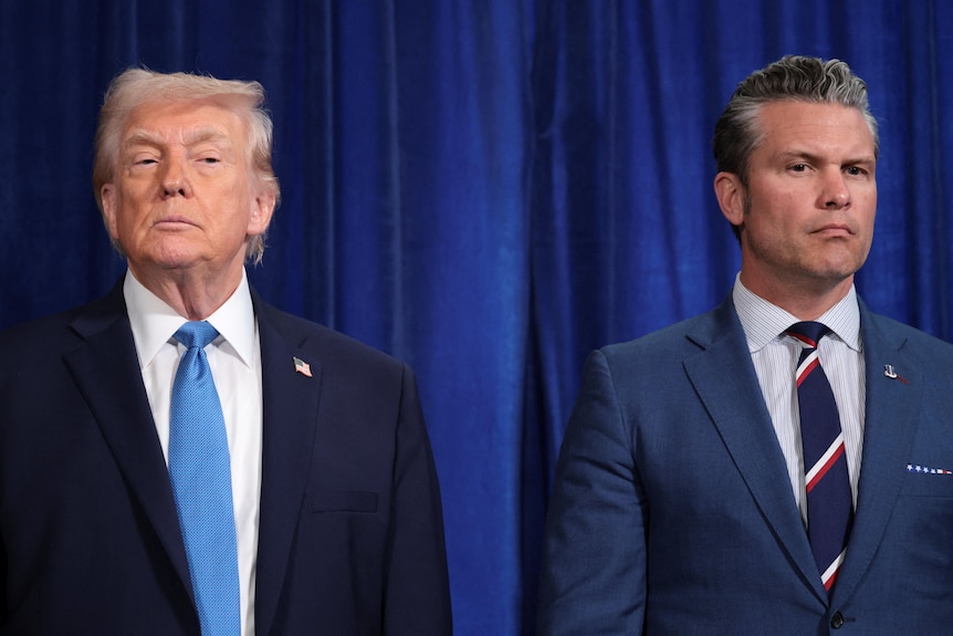 Donald Trump and Pete Hegseth standing side-by-side.