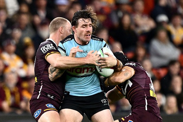Billy Burns of the Sharks is tackled during the round 18 NRL match between Brisbane Broncos and Cronulla Sharks at Suncorp Stadium, on July 04, 2026, in Brisbane, Australia. (Photo by Bradley Kanaris/Getty Images)