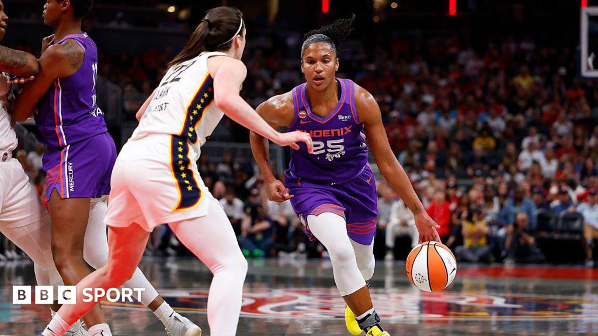 Phoenix Mercury forward Alyssa Thomas drives towards the basket while defended by Indiana Fever guard Caitlin Clark