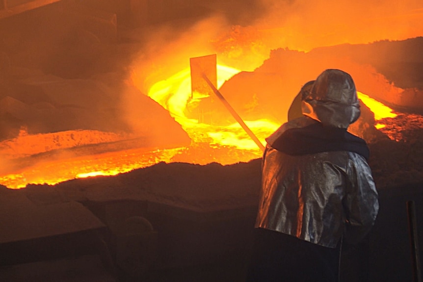 Worker inside a smelter factory.