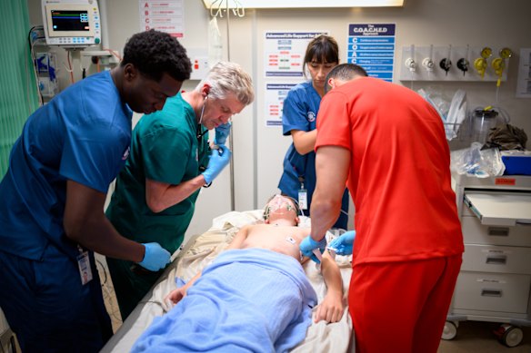 Theo Adade (Tristan Sabutey), Dr Curtis Parker (Dan Wyllie), Toby Hammond (Rupert Clarkin) and Jimmy Seufale (Ioane Sa’ula) treat a patient in emergency.
