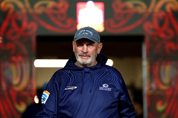 Coach Vern Cotter of the Blues looks on.