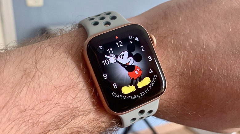 A Mickey Mouse watch face on an Apple Watch Series 4