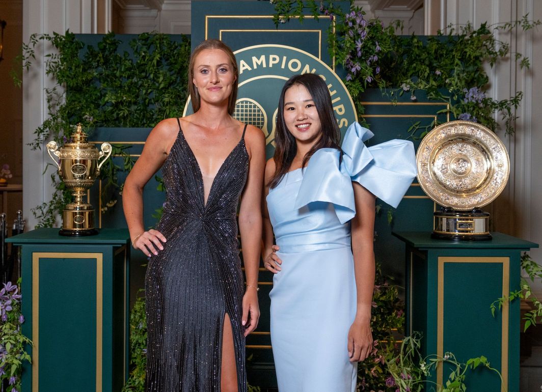 Guo and Mladenovic pose after winning their first Grand Slam title together.