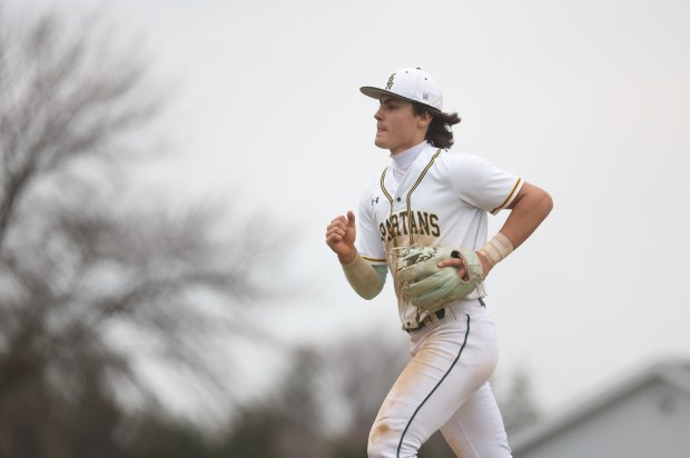 Glenbrook North shortstop Ethan Bass runs back to the dugout during a game April 9, 2026, in Northbrook. (Talia Sprague/for the Chicago Tribune)