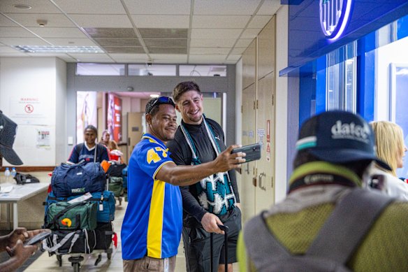 Zac Lomax poses for a selfie in PNG.