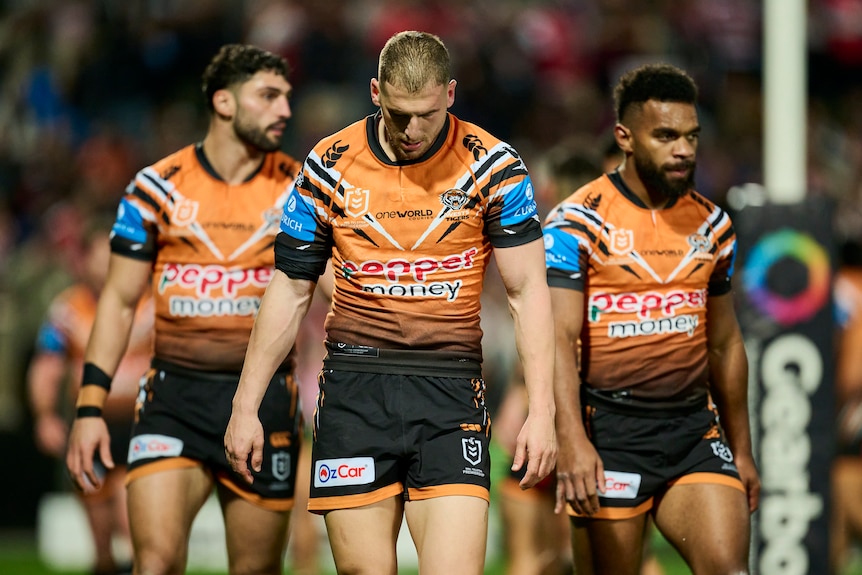A man looks dejected after losing an NRL match