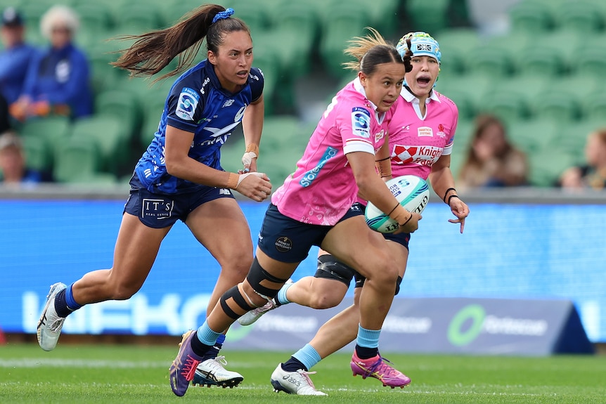 Waiaria Ellis of the Waratahs runs the ball runs the ball against the Force.