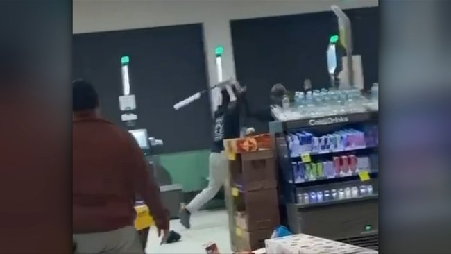 Chaos has erupted inside a Woolworths where a man is accused of harassing a woman and her children. 