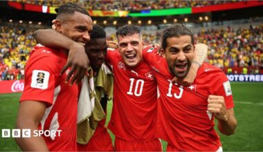Switzerland players celebrate beating Colombia