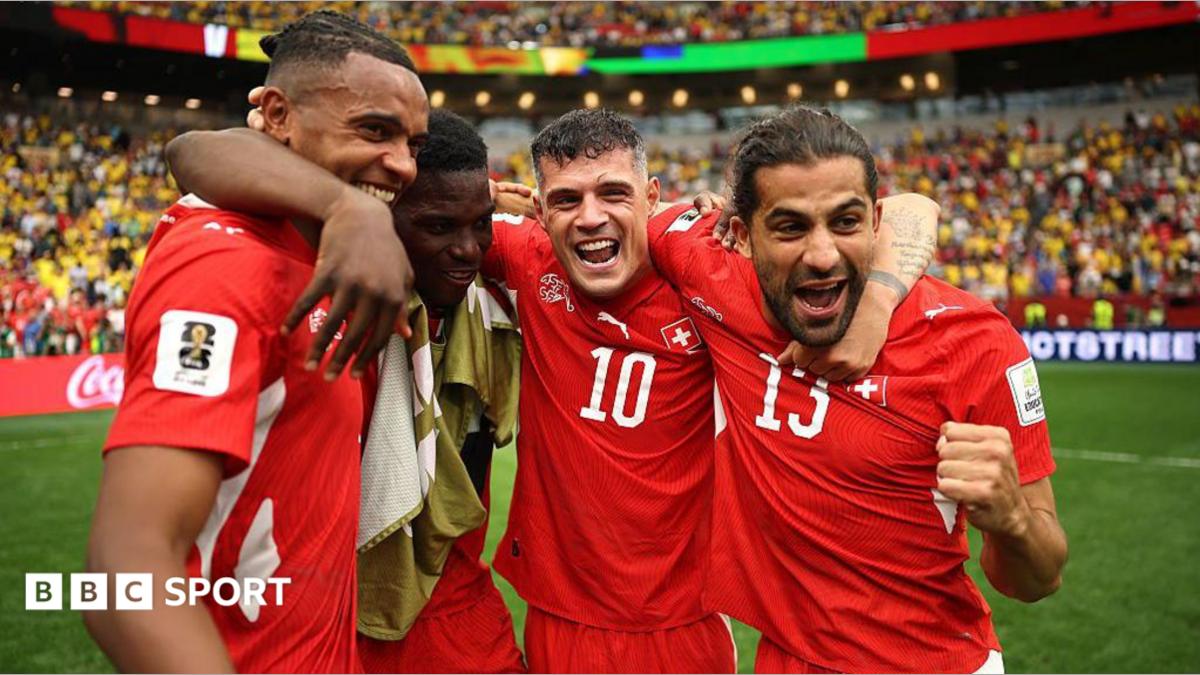 Switzerland players celebrate beating Colombia