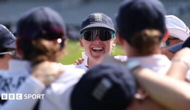 England captain Heather Knight smiles in the England team huddle before the start of play on day three against India at Lord's